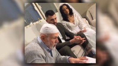 صورة عراقي وكويتية يثيران الجدل أثناء عقد زواجهما